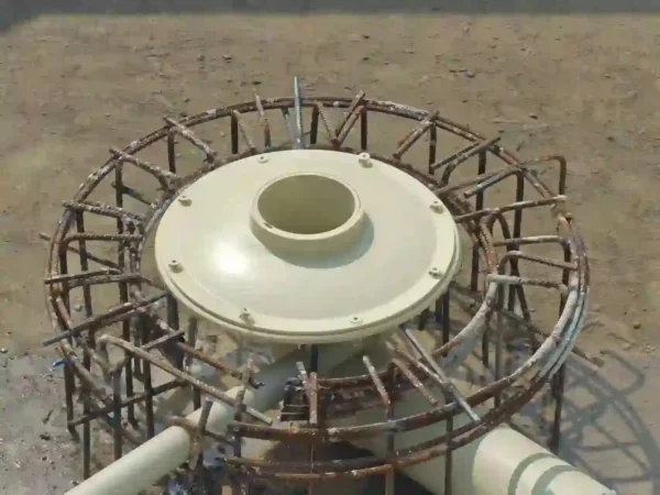 Detailed pond bottom drain plumbing setup showing the connection to a recirculating aquaculture system.