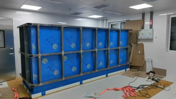 Close-up assembly of the high-precision pipe connections and hydraulic systems in the new reservoir coupled RAS pilot.