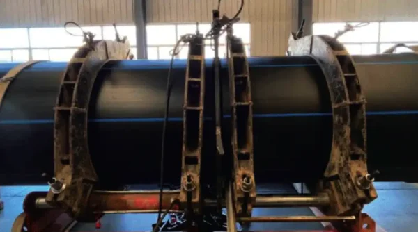 On-site heat fusion welding of HDPE water pipe for leak-free connection.